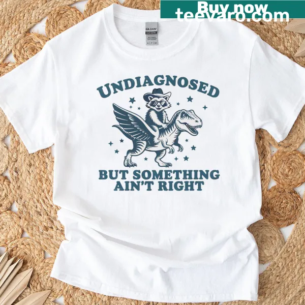 Retro tee with a raccoon and dinosaur graphic and humorous text
