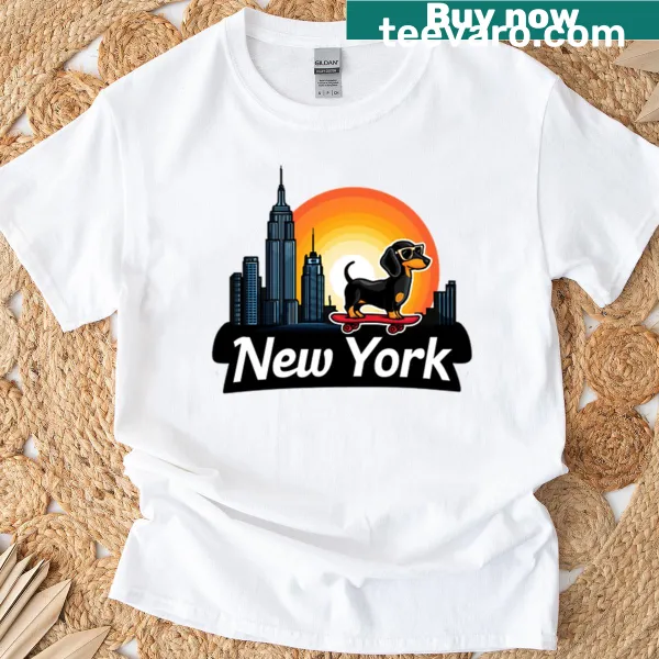 Illustrative tee featuring a skateboard dachshund against a sunset backdrop.
