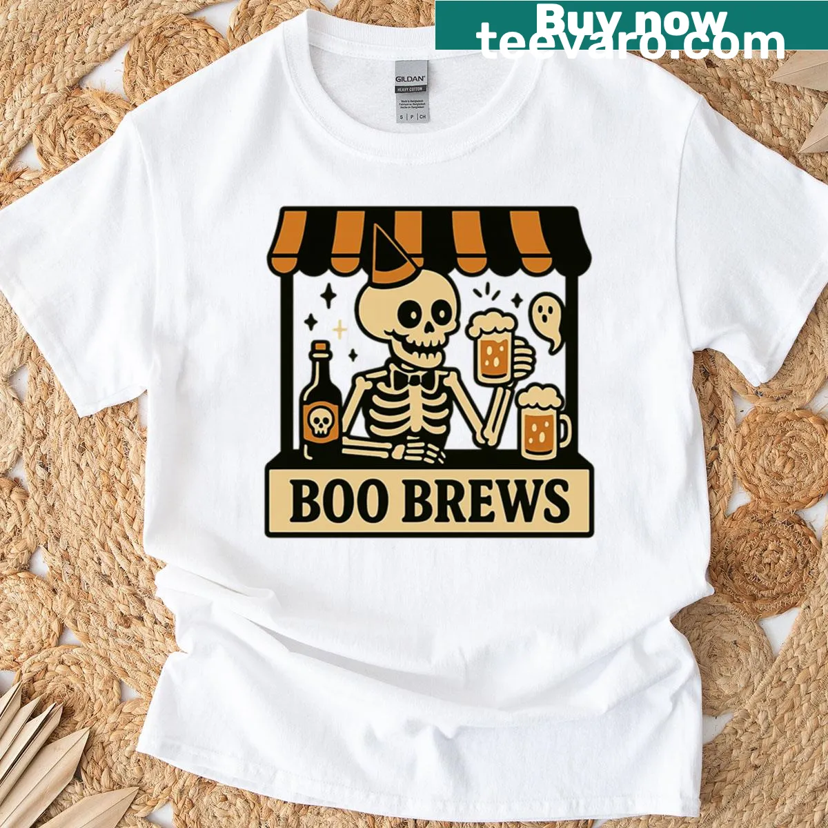 Skeleton holding a beer mug with Halloween elements for party fun — on a men's t-shirt