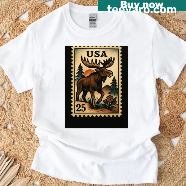 Retro tee featuring a postage stamp design with a moose and hiking theme