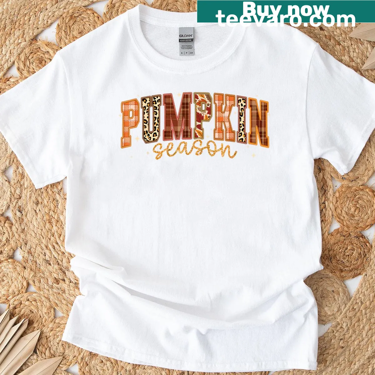 Retro autumn-themed T-shirt with pumpkins and leaves — on a men's t-shirt