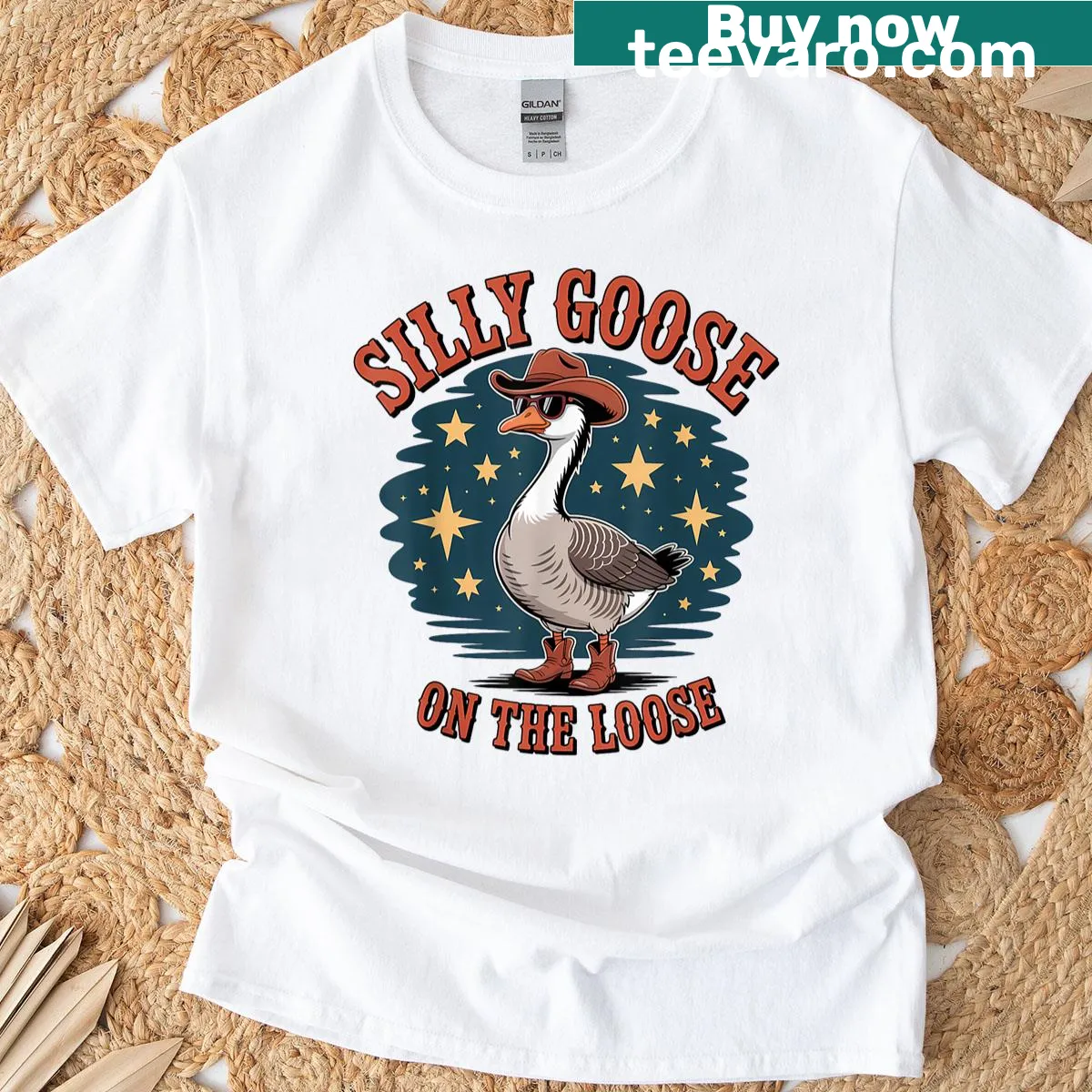 Cartoon of a silly goose with the phrase 'On The Loose' on a T-shirt — on a men's t-shirt