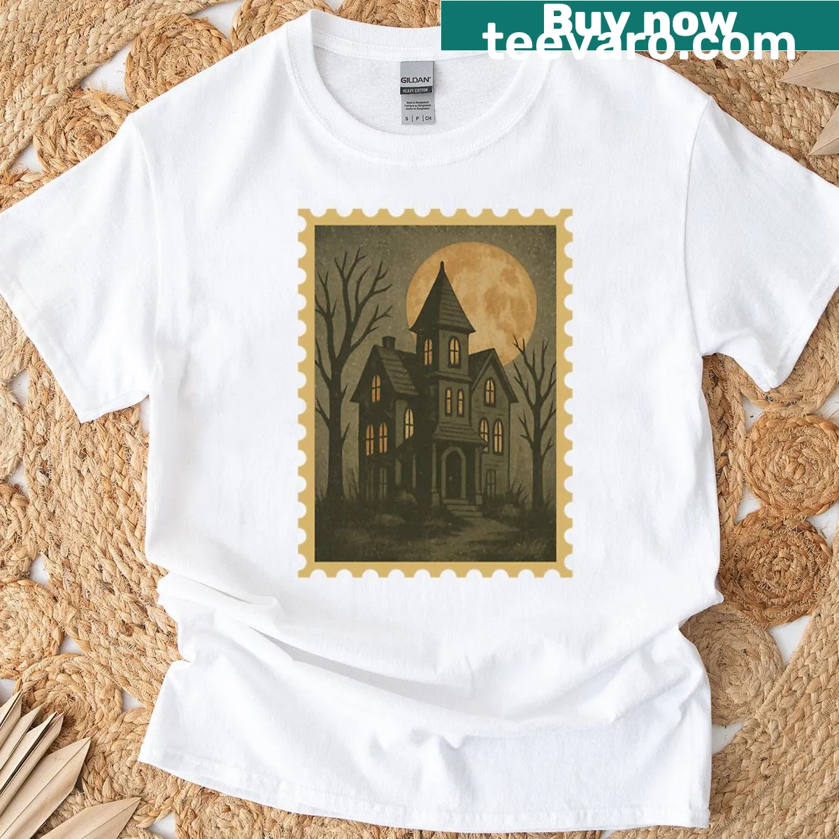 Oversized Halloween T-shirt featuring a vintage haunted house scene — on a men's t-shirt
