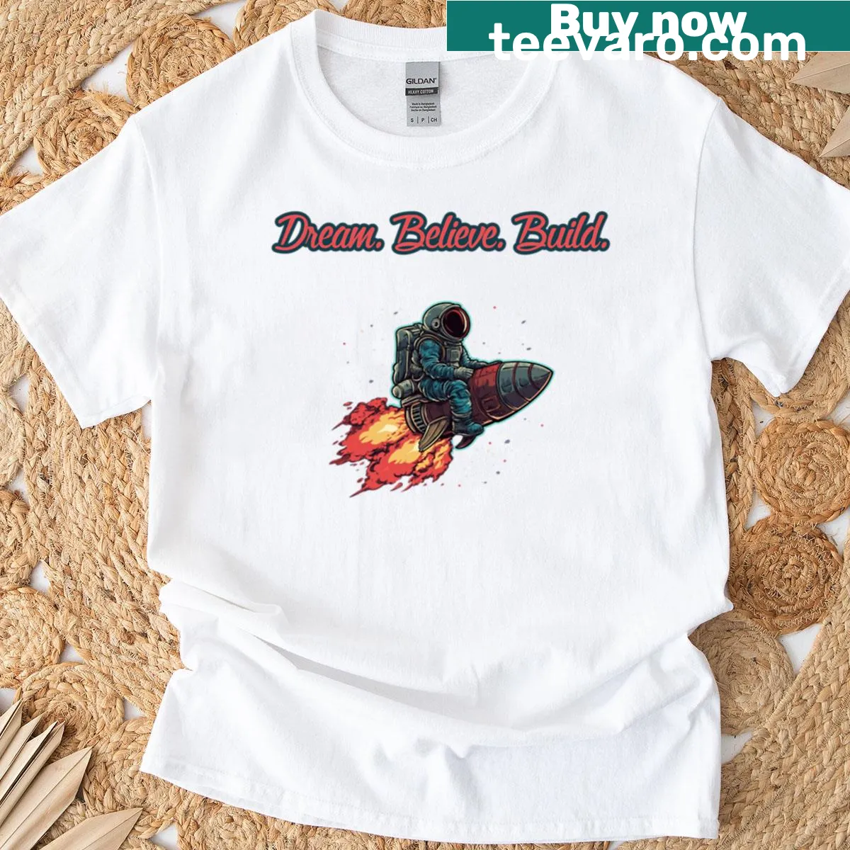 Inspirational typography reading 'Dream Believe Build' — on a men's t-shirt