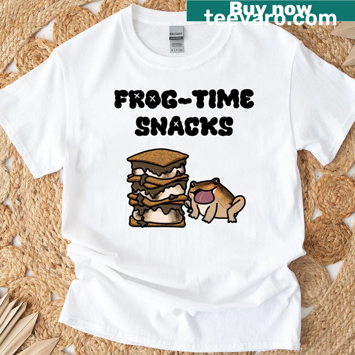 Playful T-shirt with a cartoon frog and s'mores design — on a men's t-shirt