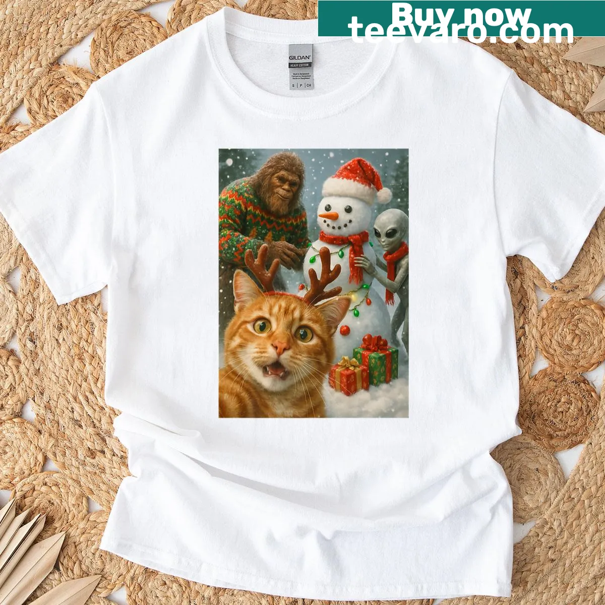 Funny Christmas t-shirt featuring a cat selfie with Bigfoot and a snowman. — on a men's t-shirt