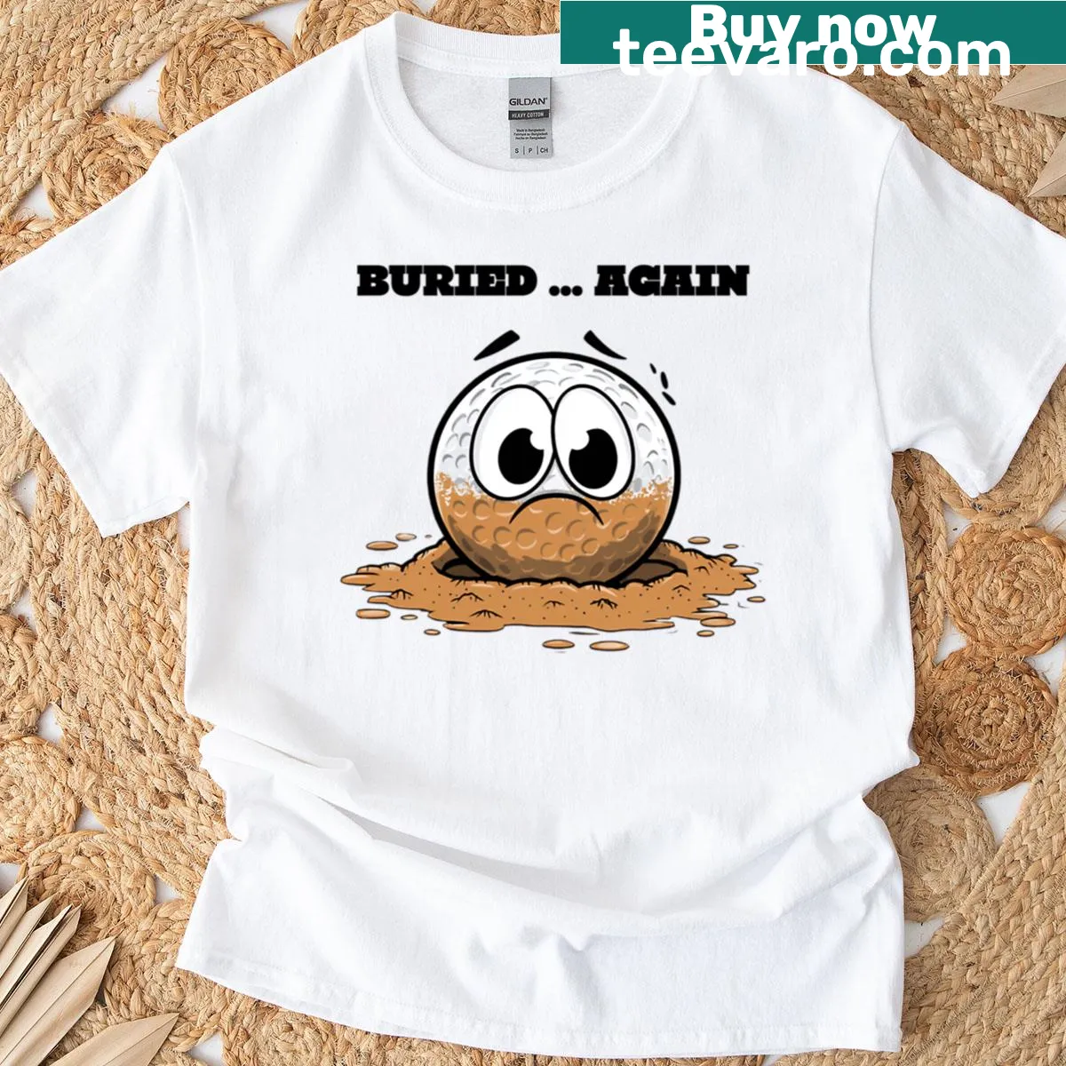 Cartoon golf ball stuck in sand with humorous expression — on a men's t-shirt