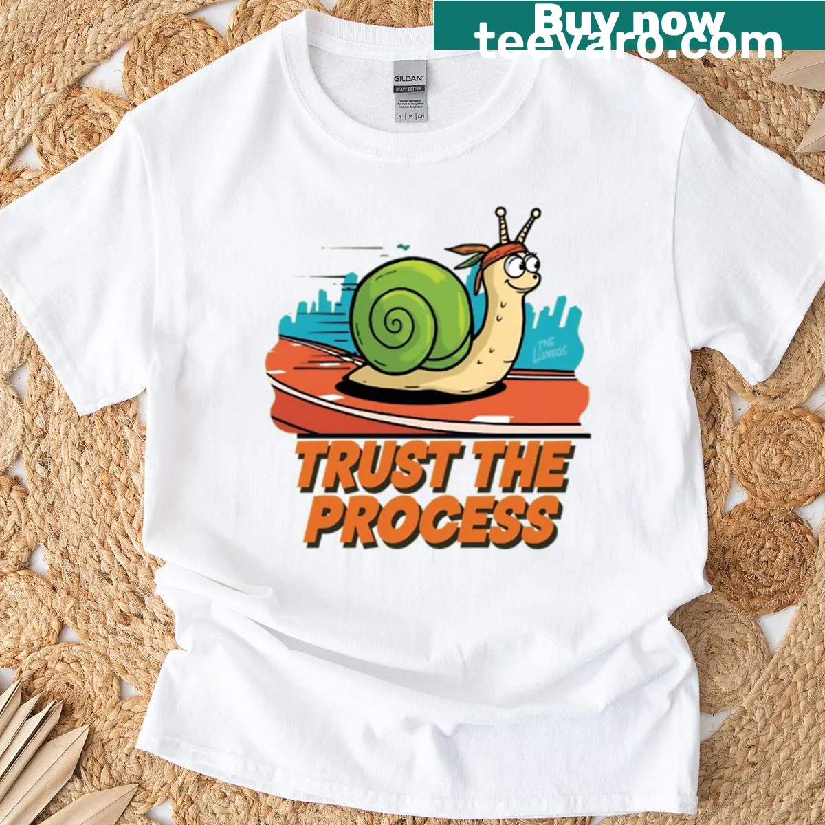 Motivational T-shirt featuring a cartoon snail and encouraging quote — on a men's t-shirt