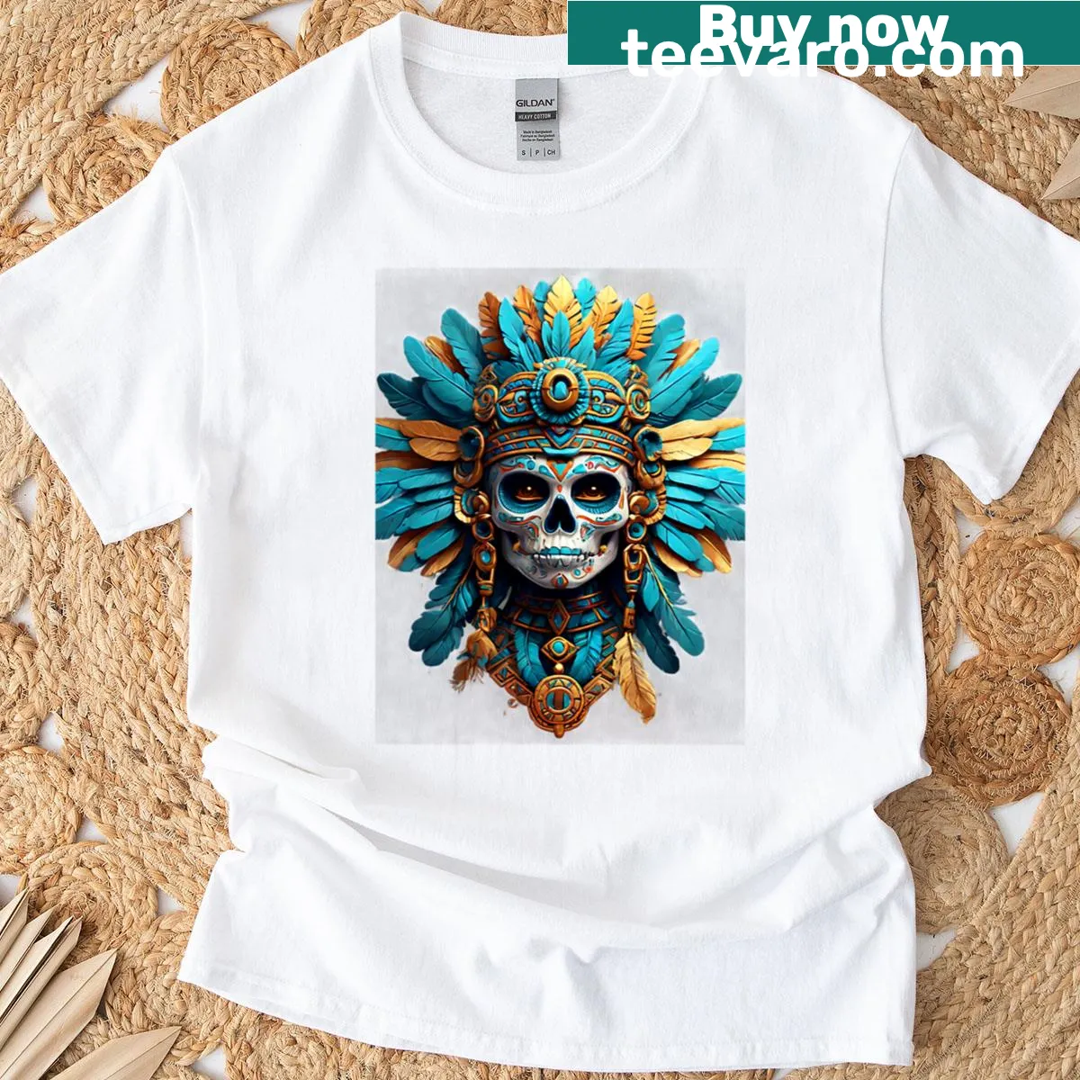 Realistic Aztec warrior skull with blue and gold feathers graphic — on a men's t-shirt