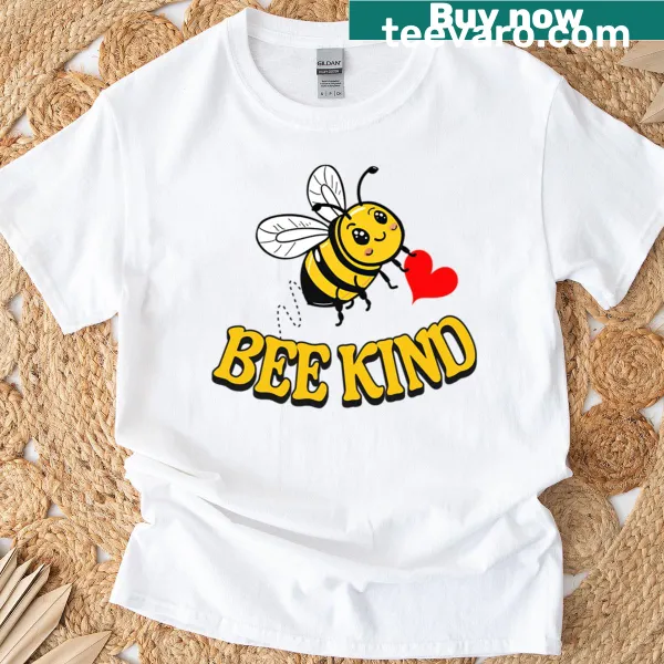 Encouraging 'Bee Kind' message with playful bee graphics on a t-shirt
