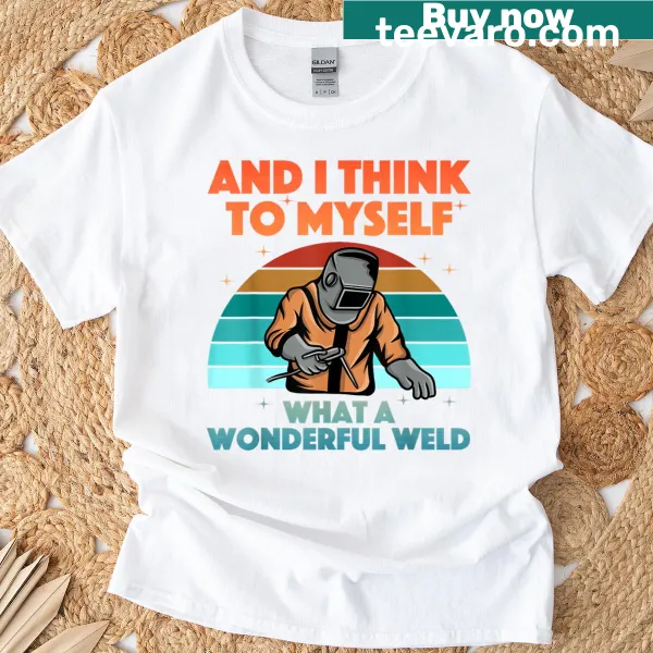 Graphic T-shirt featuring welding art and tools, celebrating the craft.