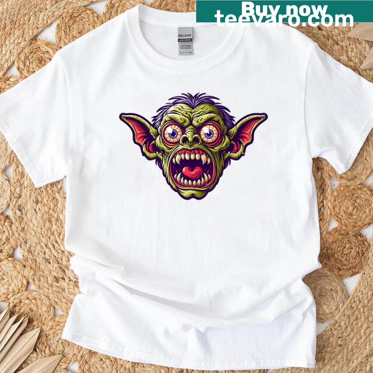 Cartoon T-shirt featuring a funny bulging eyeball goblin character — on a men's t-shirt