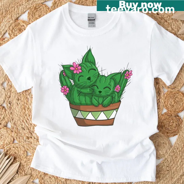 Cute T-shirt featuring cartoon cats interacting with cacti