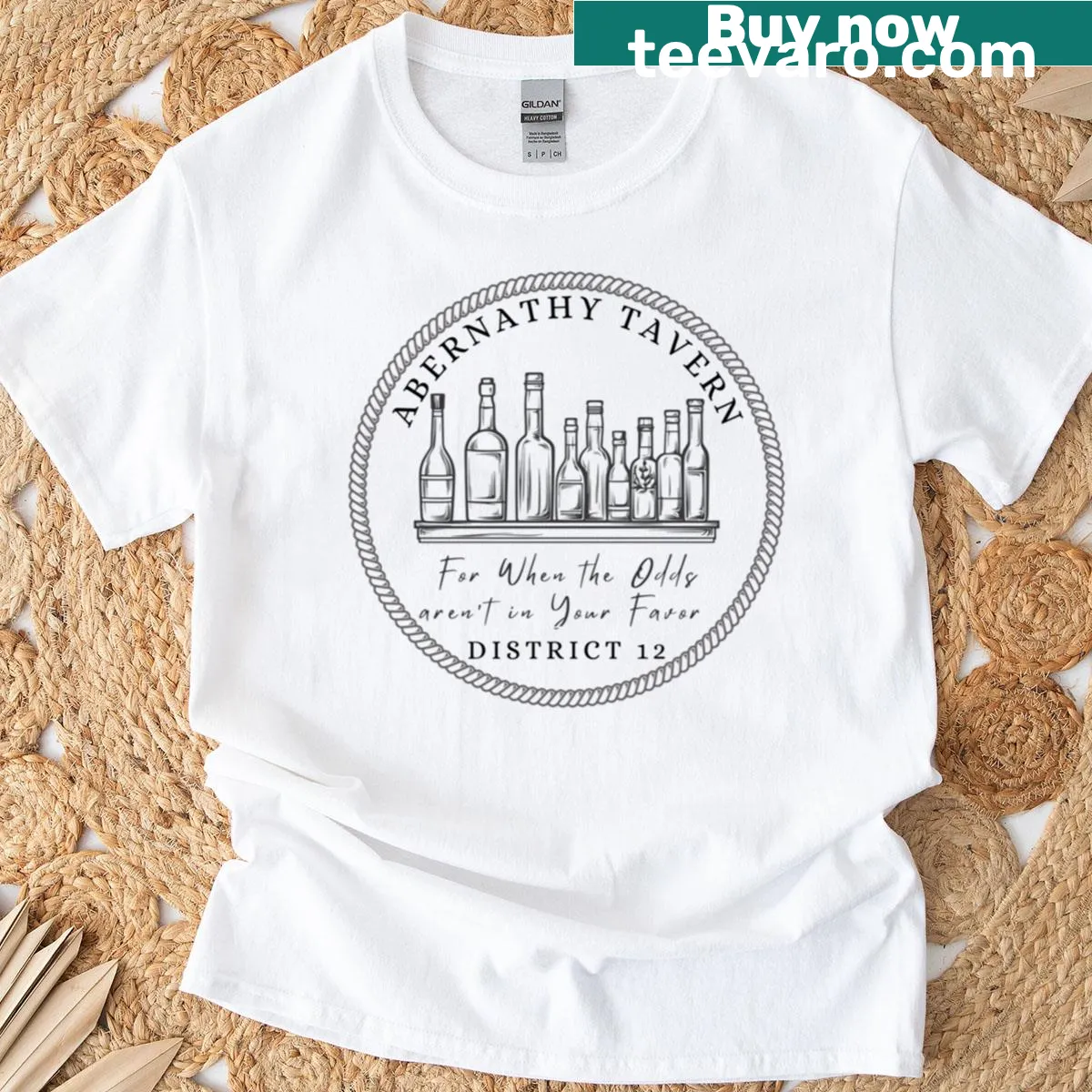 Illustrated T-shirt featuring a design inspired by Hunger Games District 12. — on a men's t-shirt