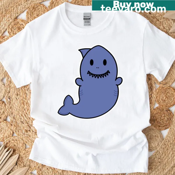 Cute cartoon shark design on a kid's t-shirt, perfect for young ocean lovers.
