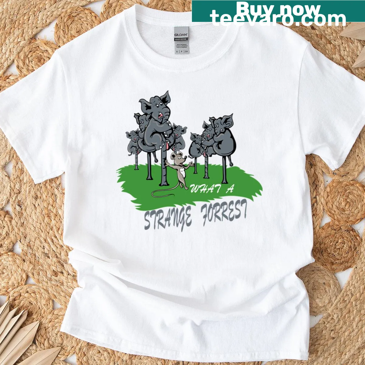 Whimsical elephant graphic set in a forest scene on a t-shirt — on a men's t-shirt
