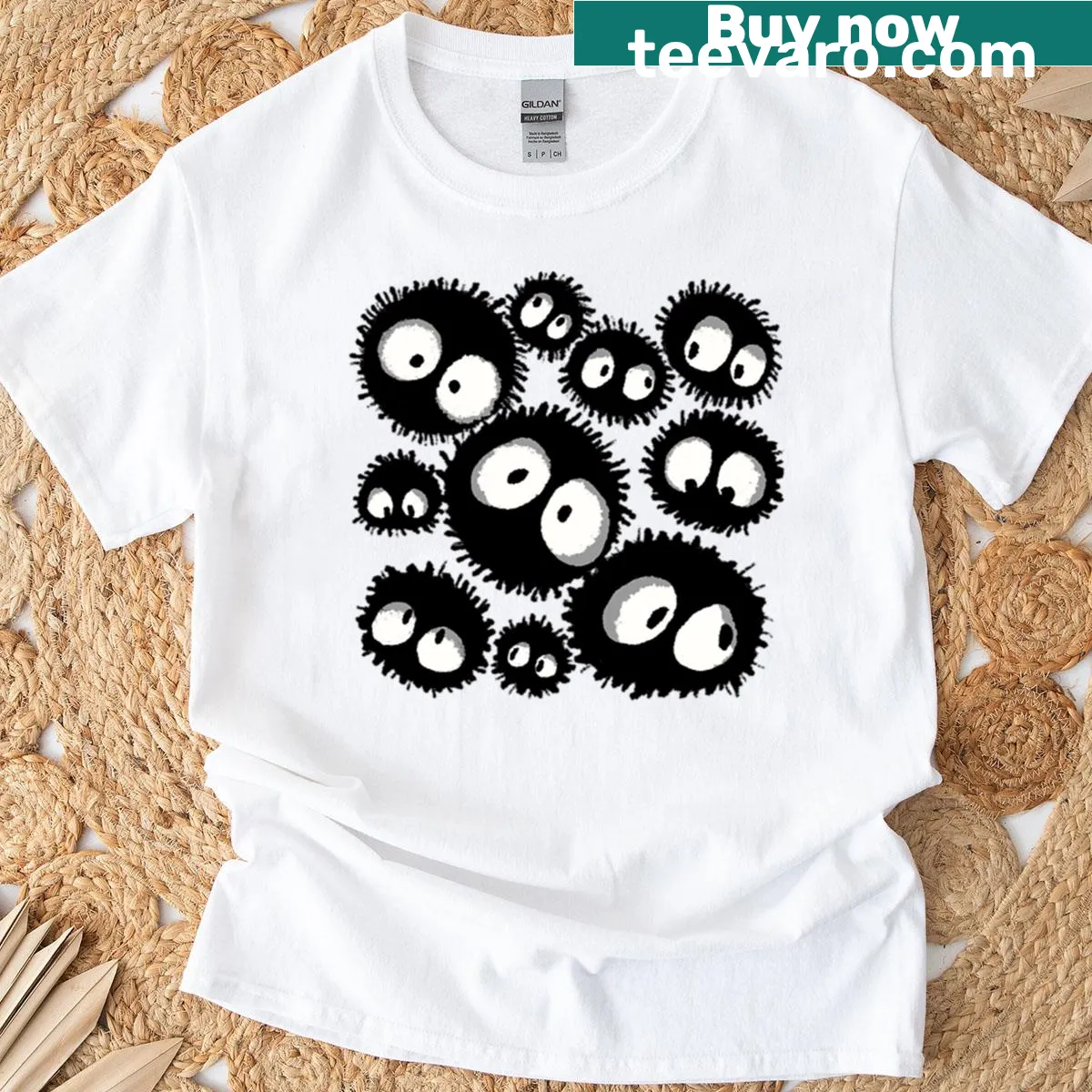Pattern of Susuwatari sprites from Spirited Away. — on a men's t-shirt