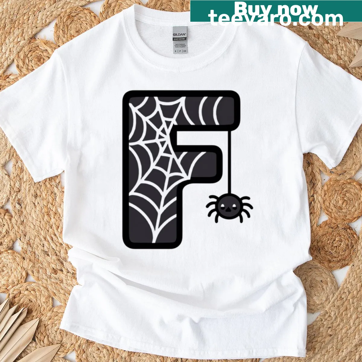 Kawaii cartoon t-shirt featuring letter F with a spider web design — on a men's t-shirt