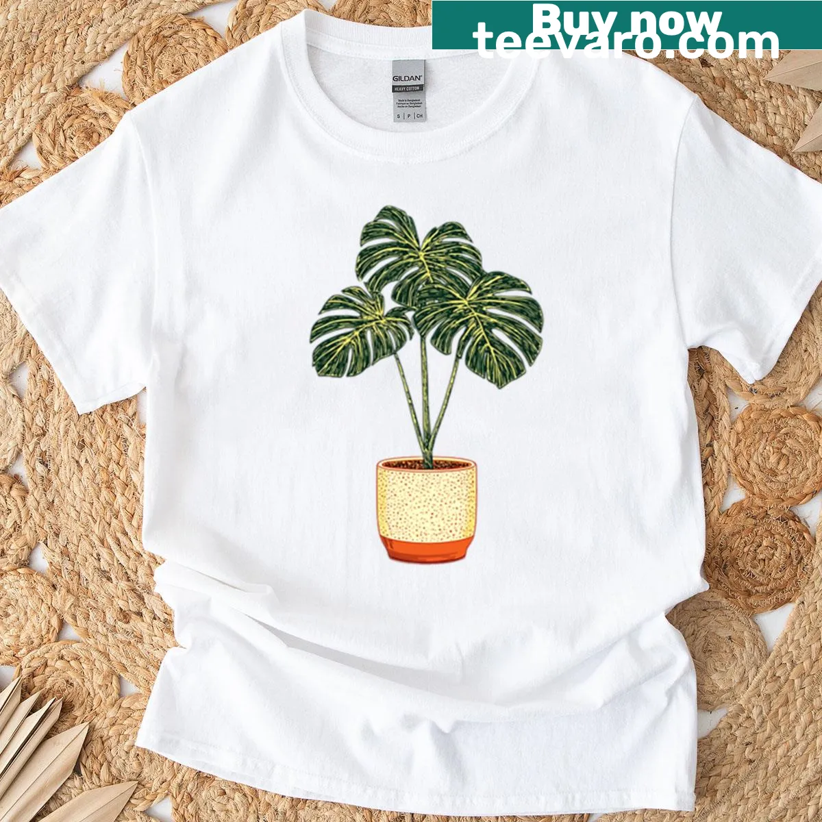 T-shirt featuring a Monstera plant illustration — on a men's t-shirt