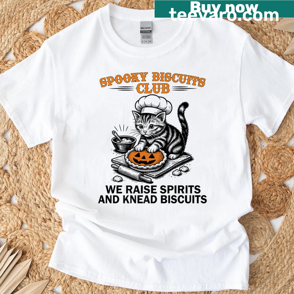 Cartoon cat baking spooky biscuits for Halloween t-shirt — on a men's t-shirt