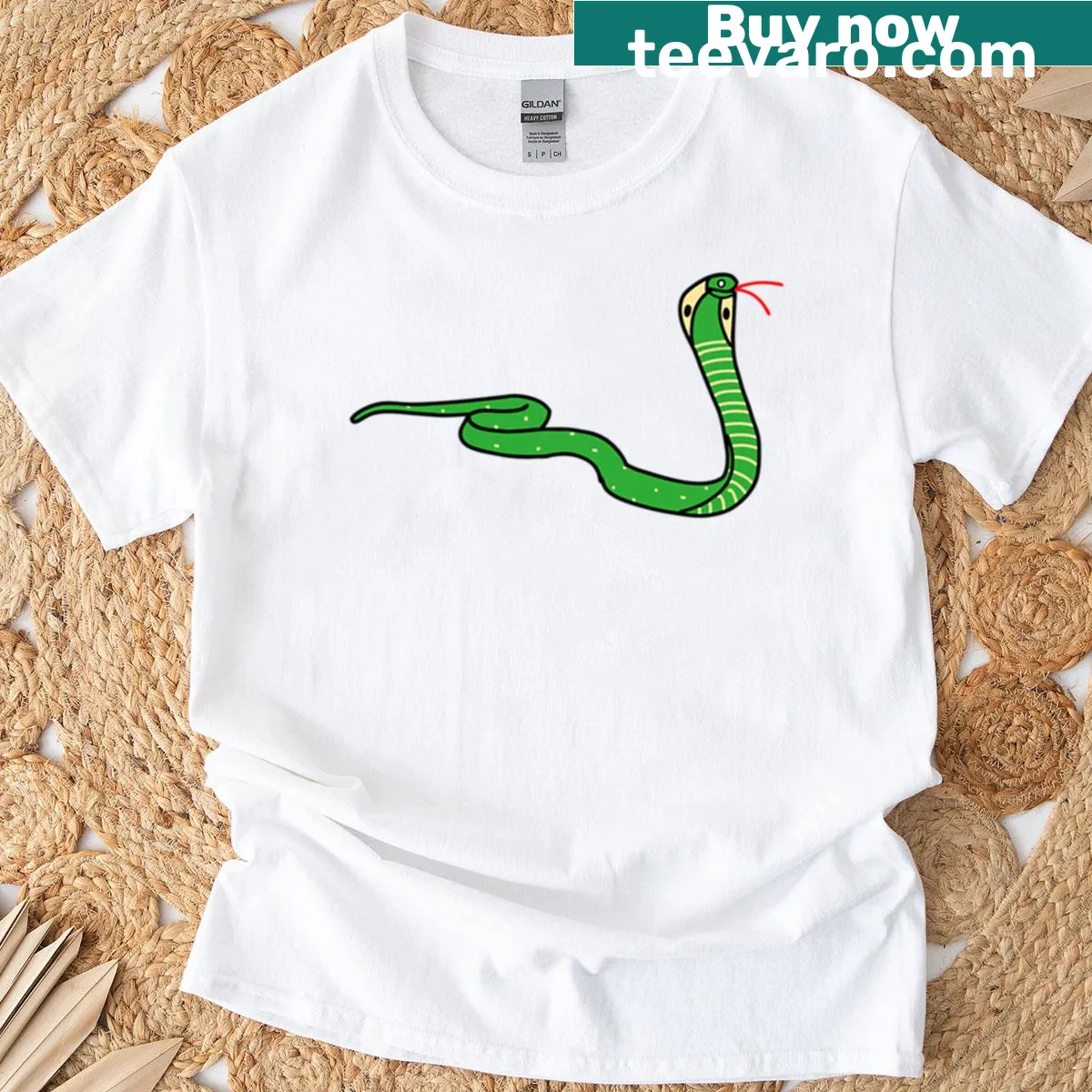 Hand-drawn cobra graphic on a shirt, showcasing intricate detail. — on a men's t-shirt