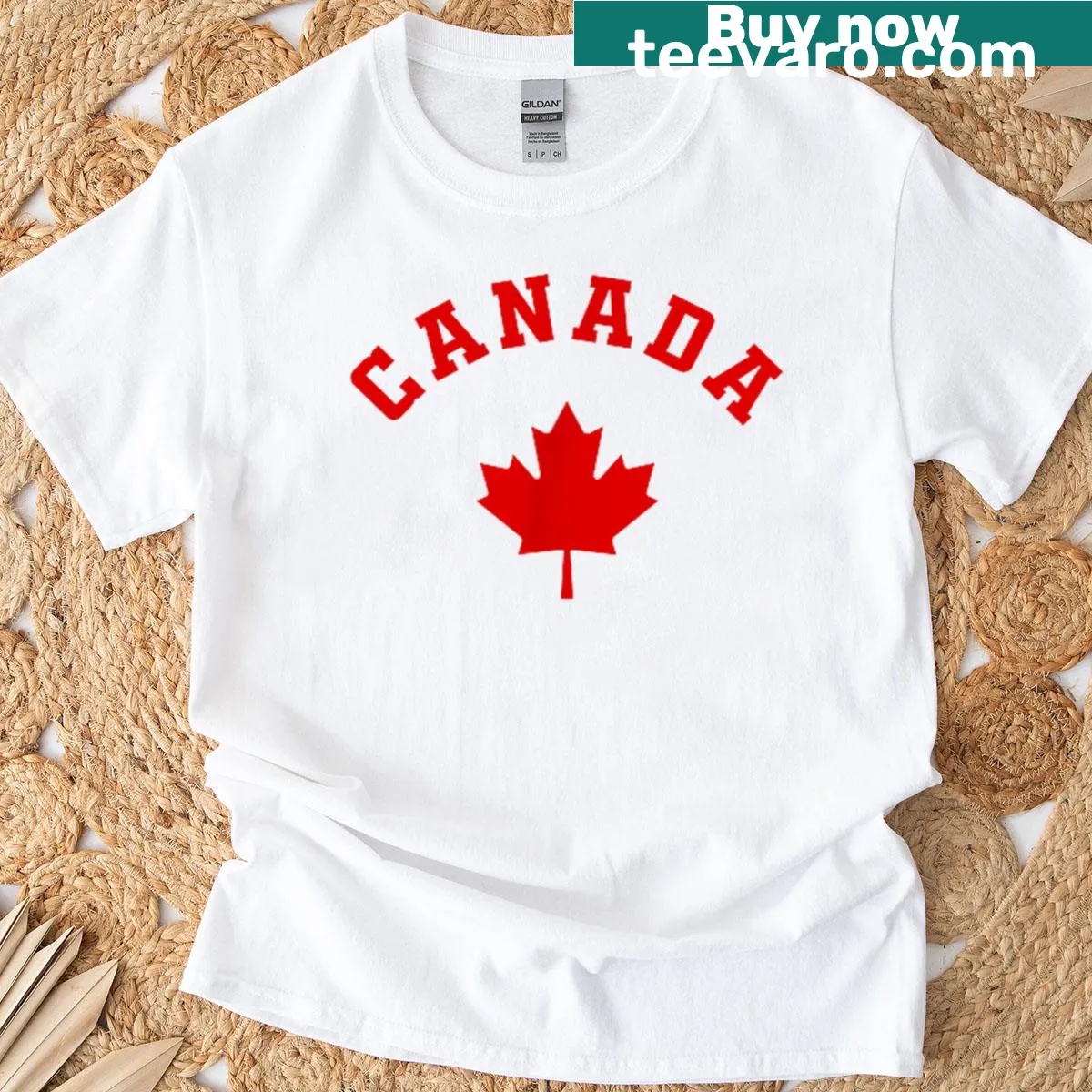 T-shirt featuring the Canadian flag and maple leaf logo — on a men's t-shirt