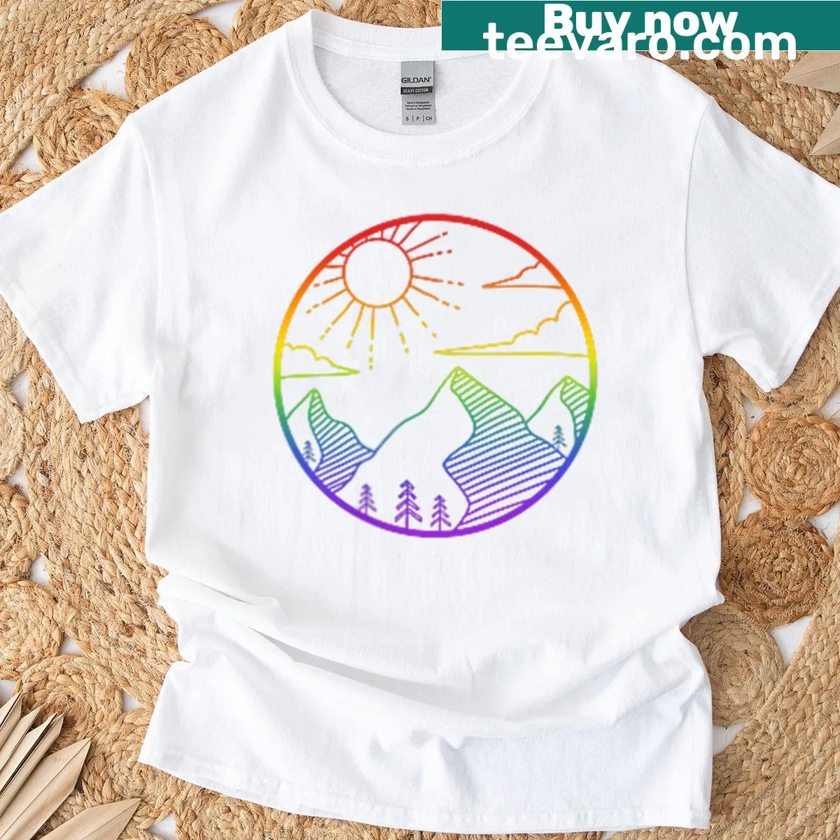 Badge-style logo t-shirt celebrating LGBTQ+ pride in a mountain setting — on a men's t-shirt