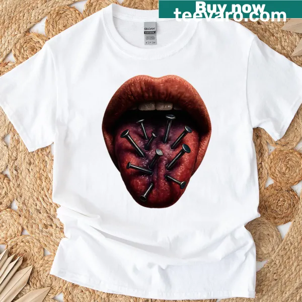 Surreal horror art featuring nails through a tongue on a T-shirt