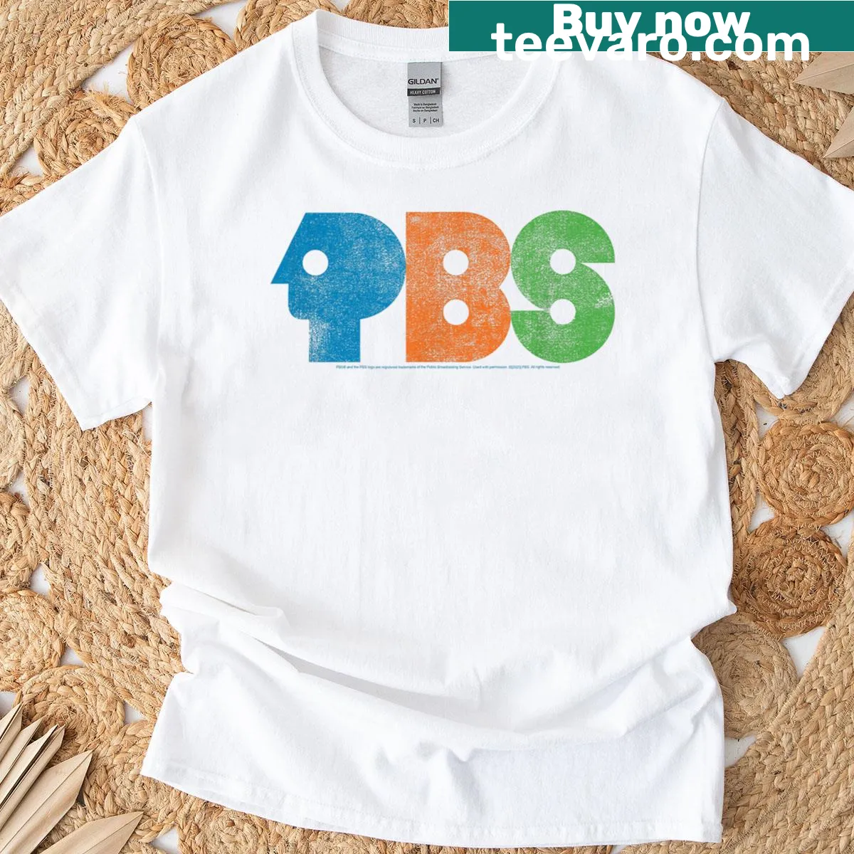 Distressed PBS logo graphic t-shirt — on a men's t-shirt