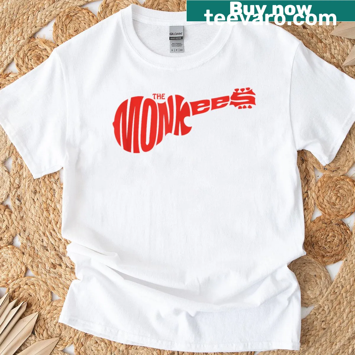 Black t-shirt featuring The Monkees red guitar logo design — on a men's t-shirt
