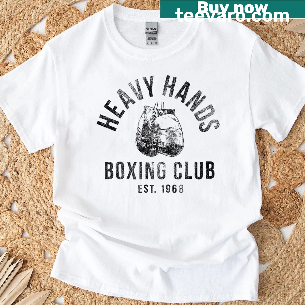 Heavy Hands Boxing Club logo graphic on a trendy t-shirt. — on a men's t-shirt