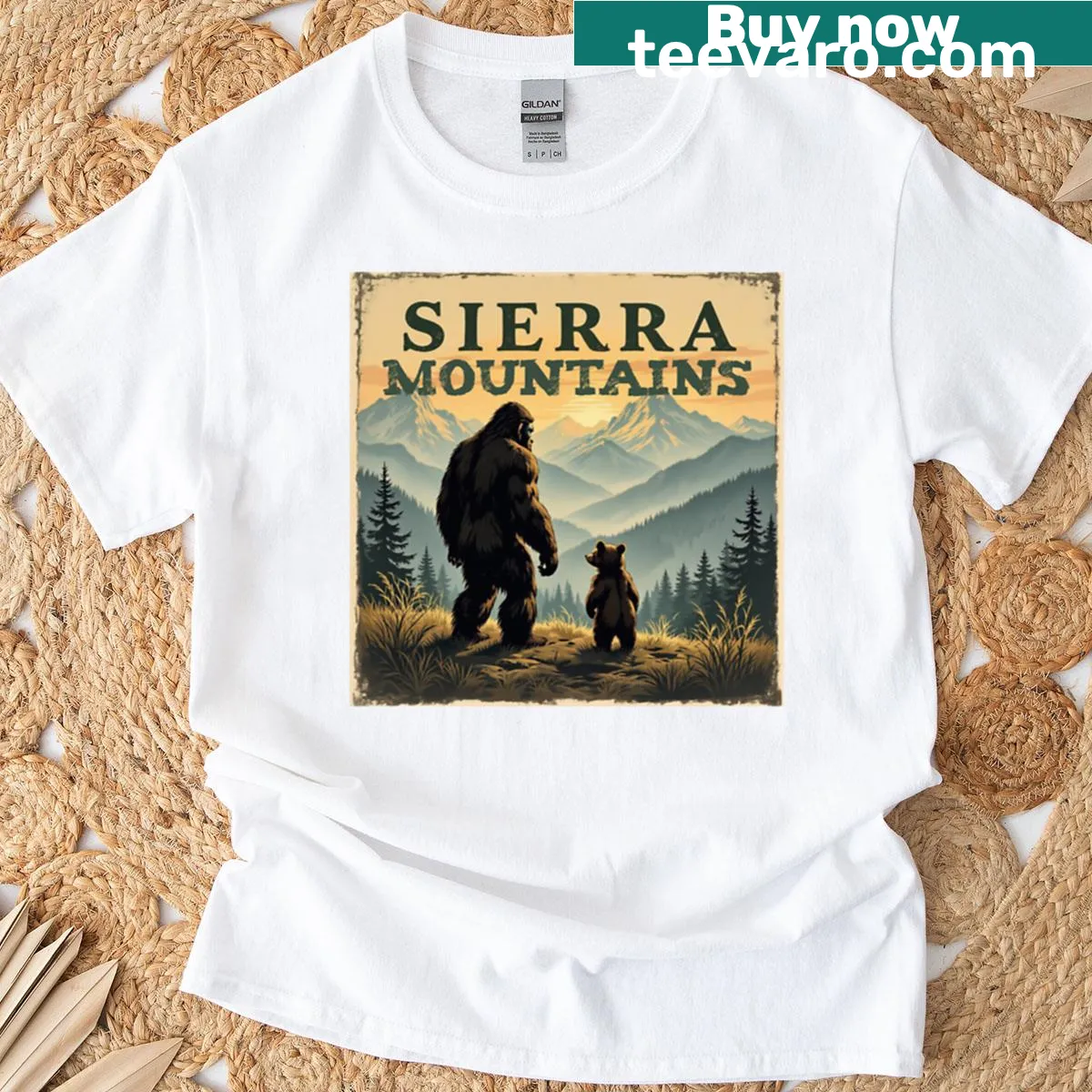 Illustrative T-shirt featuring Bigfoot with a bear and Sierra Mountains — on a men's t-shirt