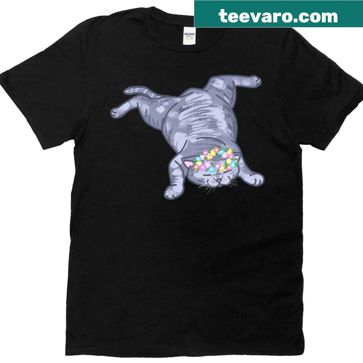 Playful illustration of a napping kitten among flowers — on a men's t-shirt