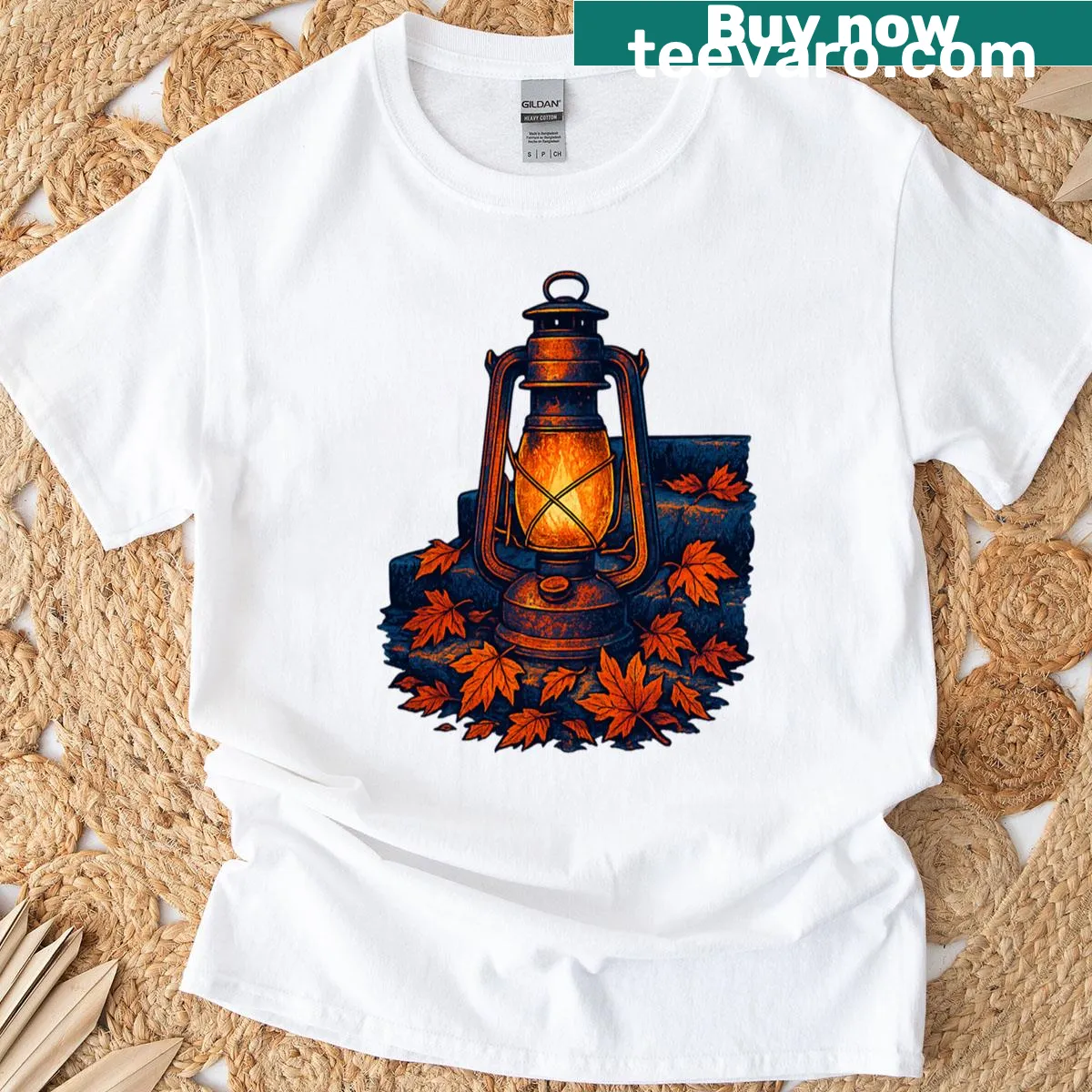 Illustrative t-shirt featuring a lantern and falling leaves inspired by dark academia — on a men's t-shirt