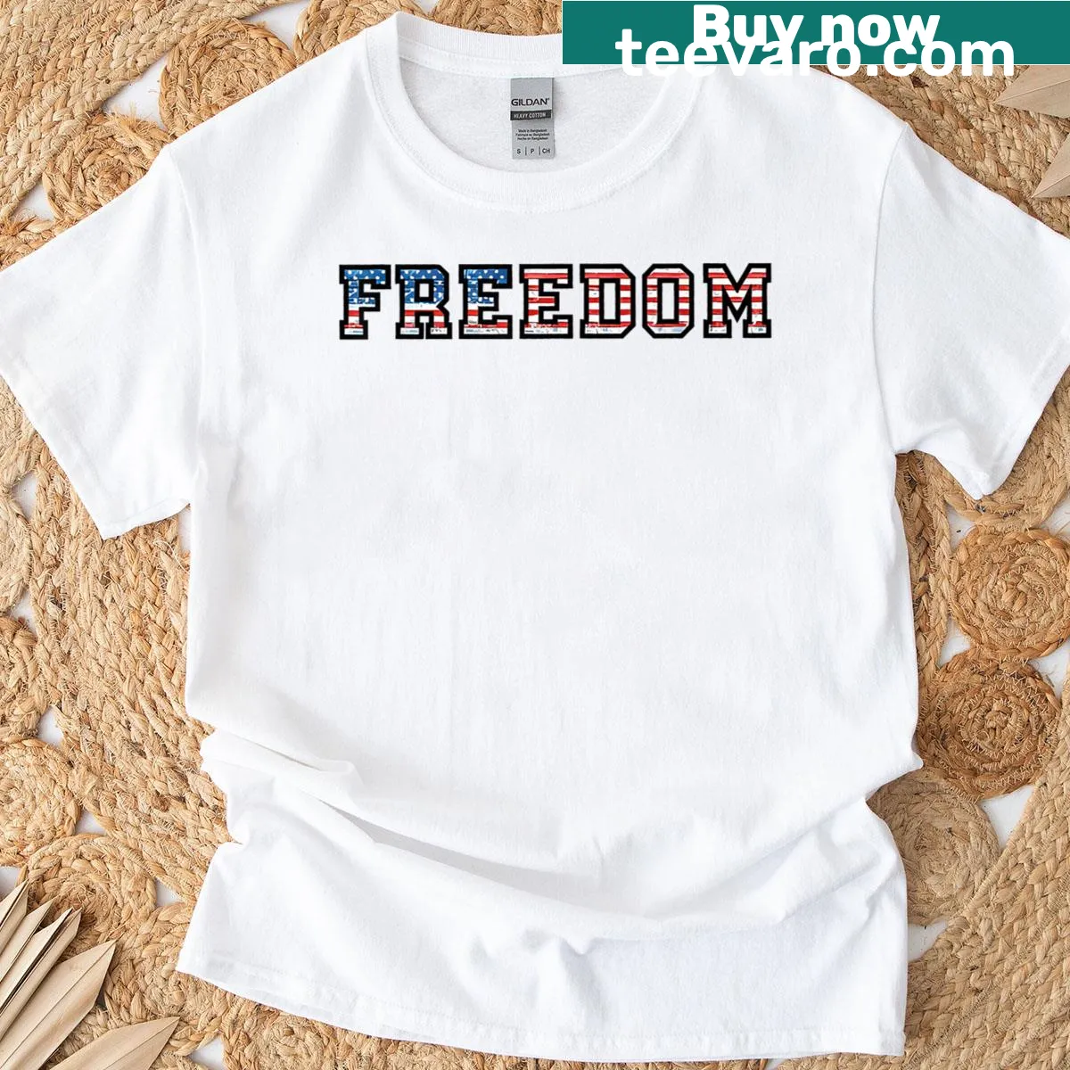 Minimalist T-shirt with bold black text saying Freedom — on a men's t-shirt
