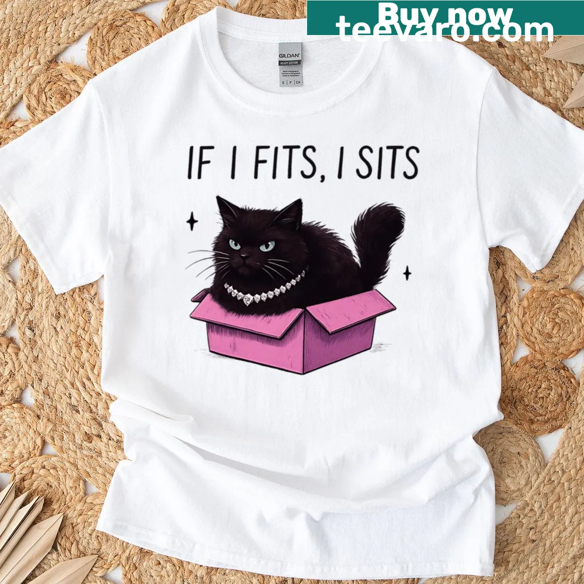 T-shirt featuring a cartoon cat trying to fit into a box. — on a men's t-shirt
