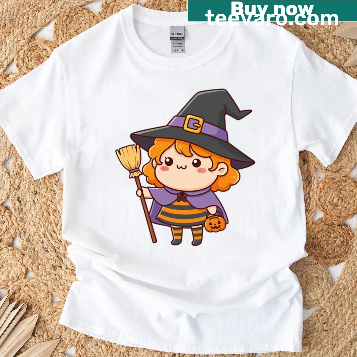 Cute T-shirt featuring a kawaii witch girl with broom and pumpkin graphic. — on a men's t-shirt