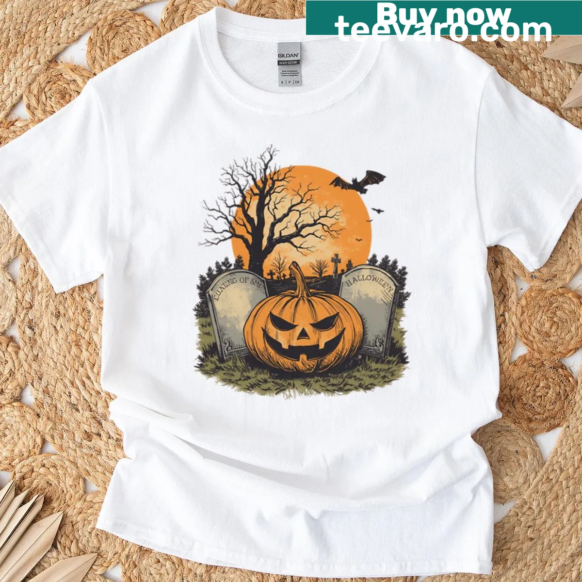 Vintage Halloween t-shirt with jack-o-lantern, bat, and graveyard design. — on a men's t-shirt