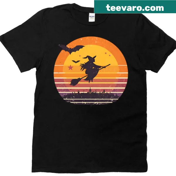 Vintage Halloween shirt with a witch flying on a broomstick at sunset