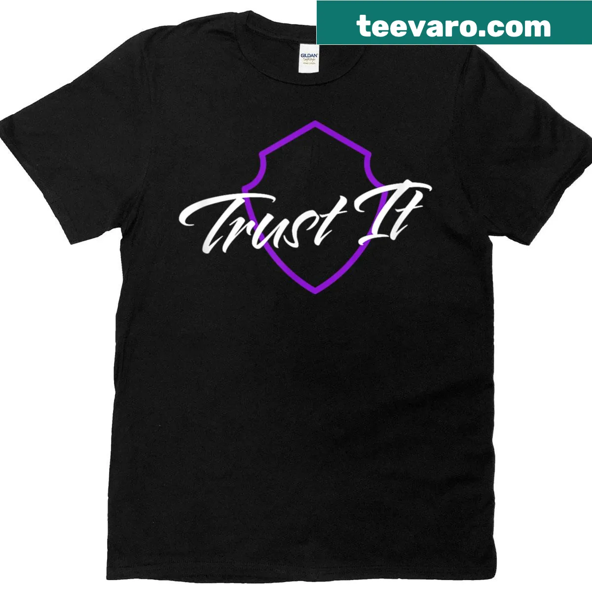 T-shirt featuring a badge-style shield graphic with the text 'Trust It.' — on a men's t-shirt
