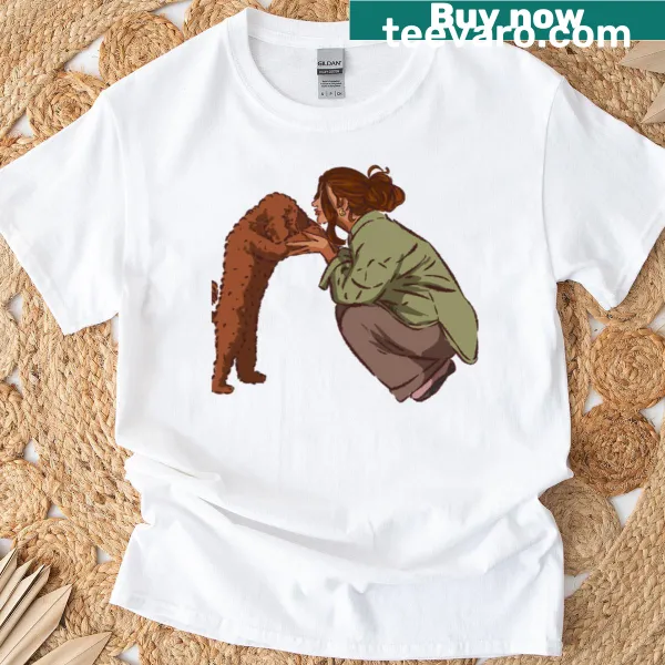 T-shirt showing a woman happily playing with her dog