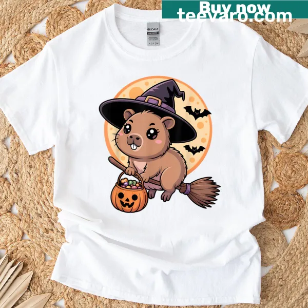 Cartoon T-shirt featuring a capybara in a witch hat and pumpkins