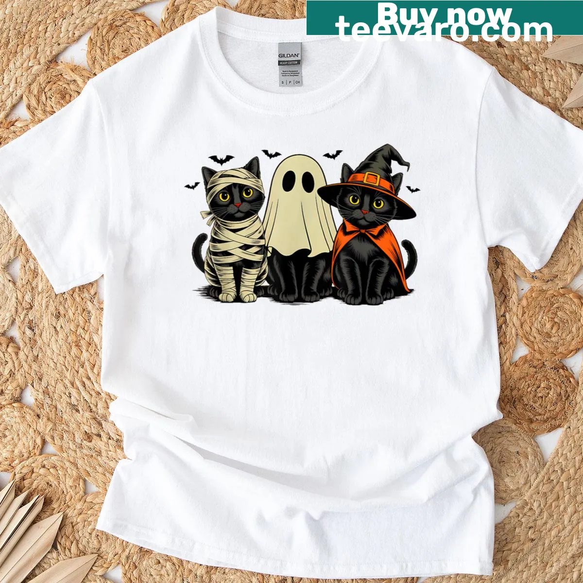 Whimsical design featuring Halloween characters like ghost and pumpkin — on a men's t-shirt