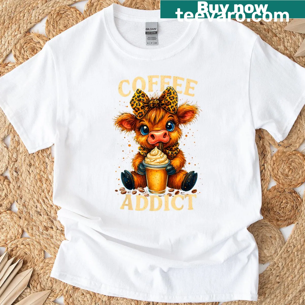 Funny T-shirt featuring a cute Highland cow with coffee cups — on a men's t-shirt