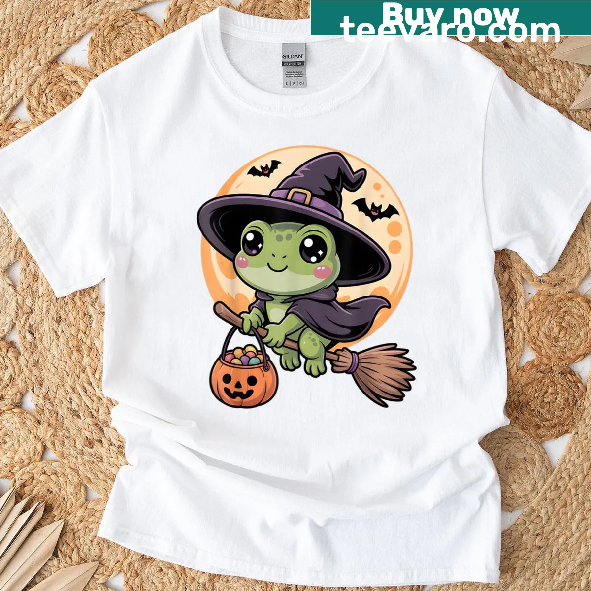 Frog wearing a witch hat and pumpkin design on Halloween T-shirt — on a men's t-shirt