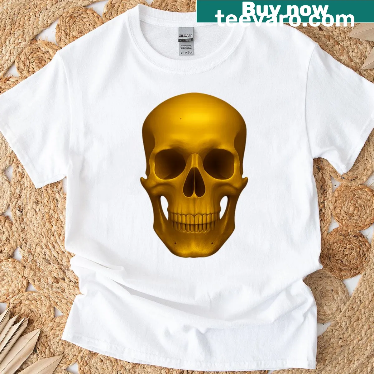 Bold golden skull graphic radiating energy on a T-shirt — on a men's t-shirt