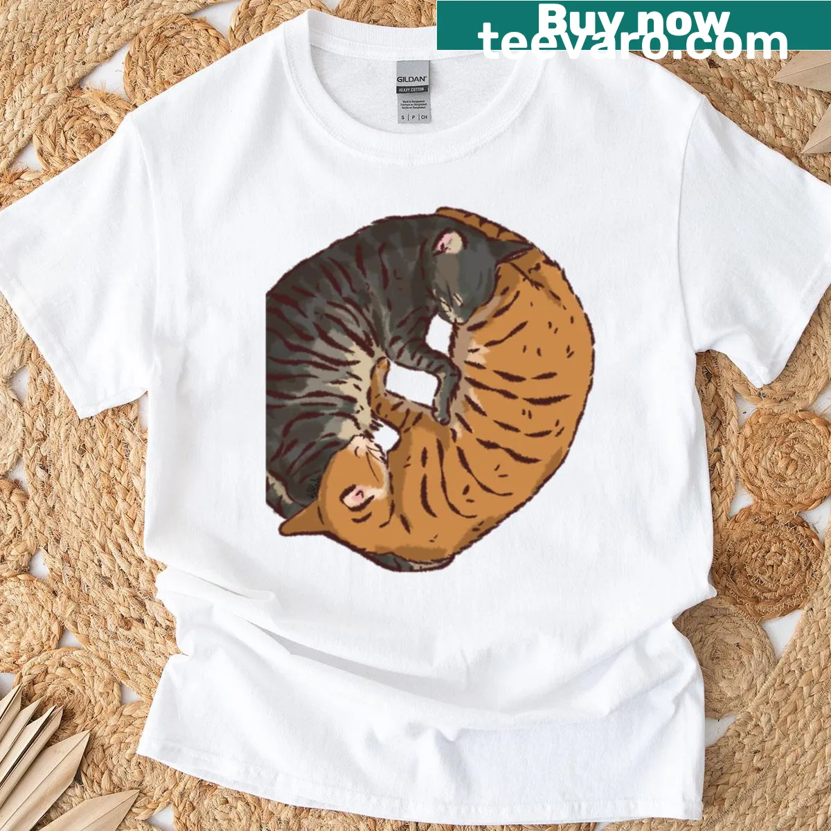 T-shirt featuring playful orange and black cat graphics — on a men's t-shirt