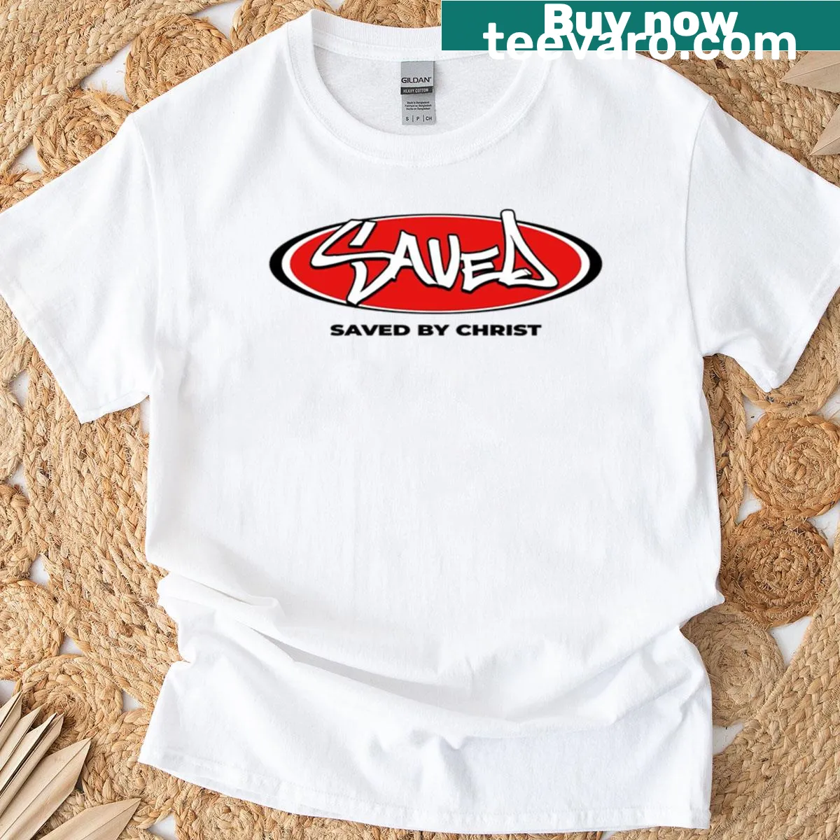 Graffiti-style 'Saved' text graphic on a T-shirt — on a men's t-shirt