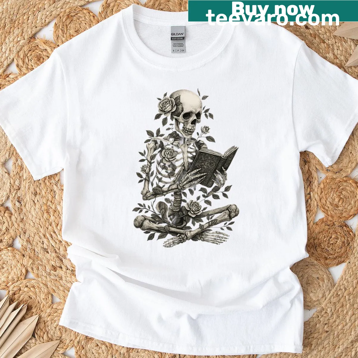 Skeleton reading among flowers design for Halloween t-shirt — on a men's t-shirt