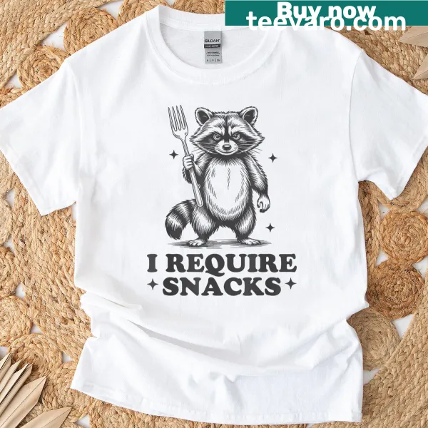 Whimsical raccoon shirt with 'I Require Snacks' quote